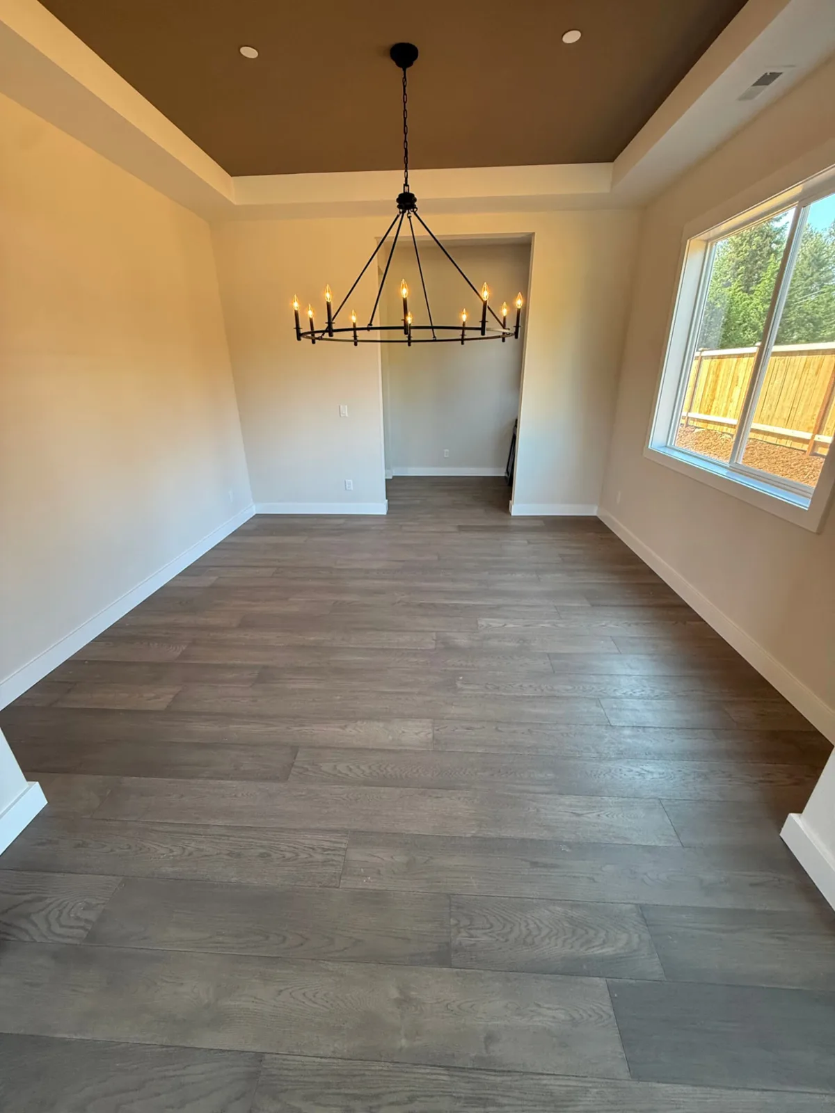 MK Flooring finished wide-plank floor in a Snohomish dining room